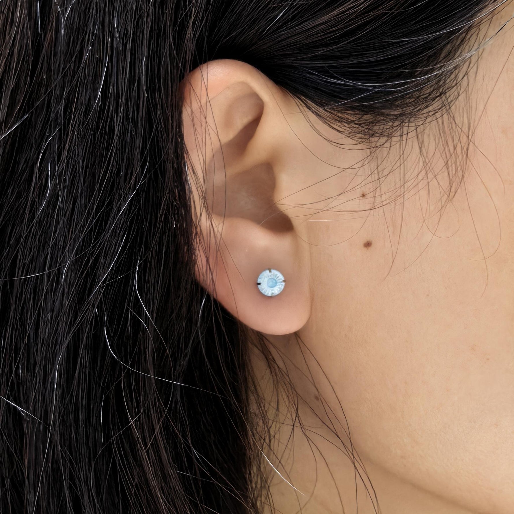 Close‑up ear wearing shot, 6 mm conch faceted cubic zirconia cartilage stud earring, waterproof titanium steel ear jewellery