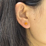 Close‑up wearing shot for 6mm fat‑square‑bouquet cut cubic zirconia cartilage stud, nickel‑free titanium screw‑back