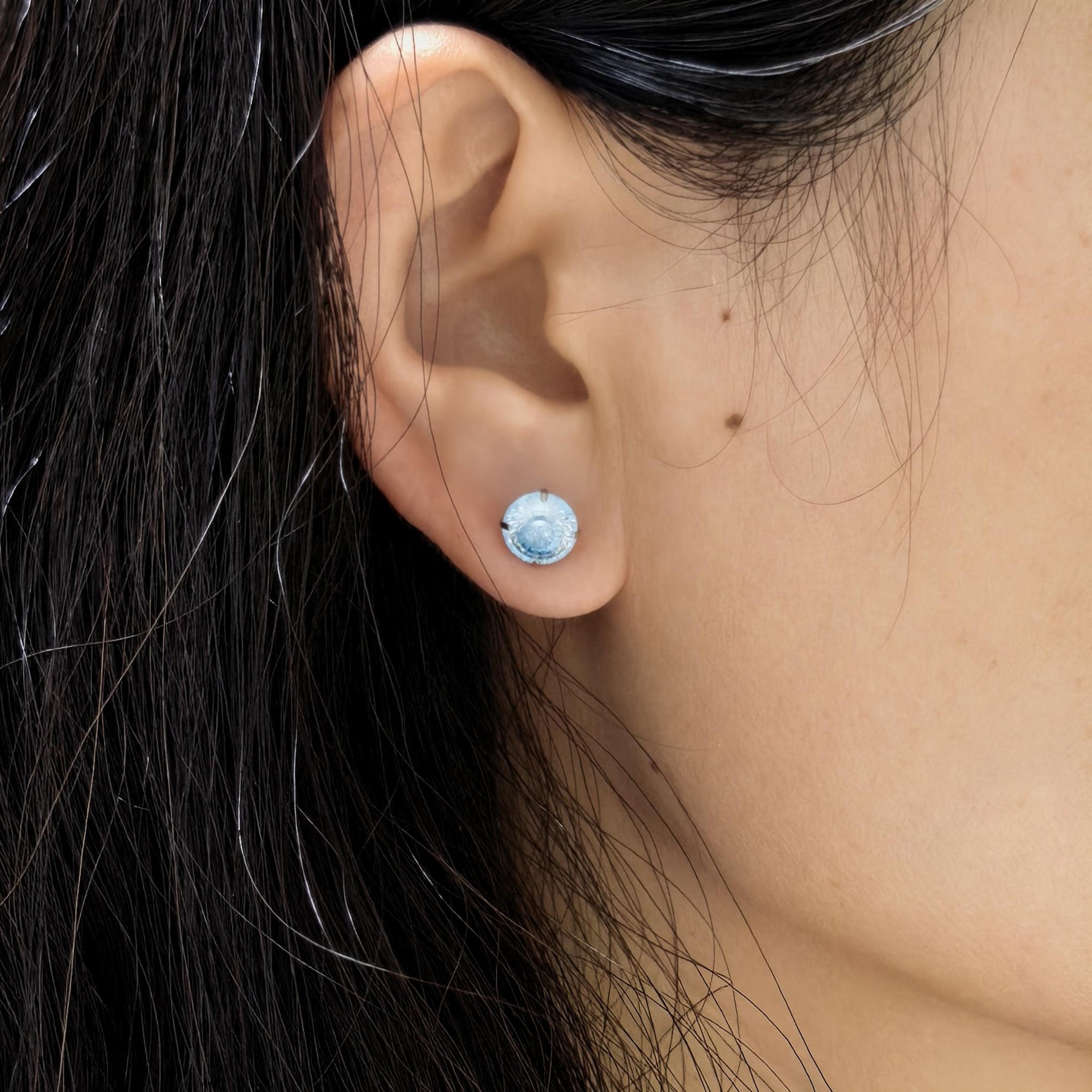 Human ear wearing photograph of 8 mm conch faceted cubic zirconia cartilage stud, tarnish‑proof titanium steel earring