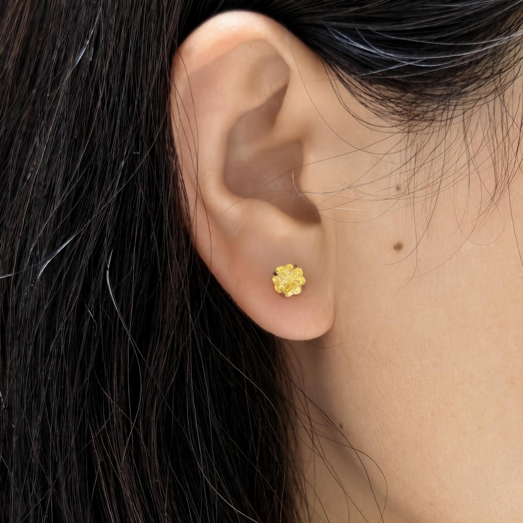 Ear wearing photograph, 6mm four‑leaf clover faceted cubic zirconia cartilage stud, nickel‑free titanium screw‑back earring